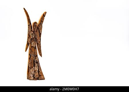 Craft work angel made of wood isolated on white background as greeting card for Christmas or Advent Stock Photo