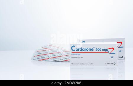 CHONBURI, THAILAND-SEPTEMBER 23, 2022 : Cordarone in blister pack and paper box packaging. Sanofi product. Amiodarone white tablet pills for treatment Stock Photo