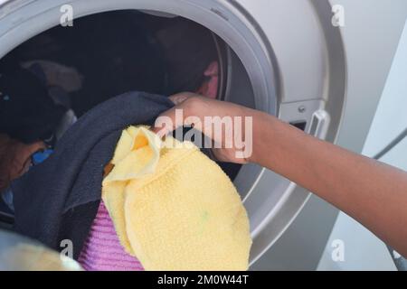 close up of cloths in a washing machine. Stock Photo