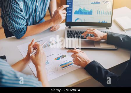 Businessman investment consultant analyzing company financial report working with documents graphs.Concept for marketing meeting. Stock Photo