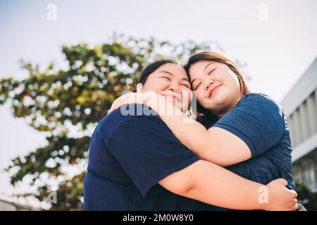 Happy multicultural enjoying vacation outdoors - Smiling group of friends having fun walking outside - Friendship concept with diversity girls. Stock Photo