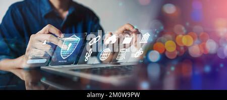 IT specialist work on computer with data protection of cyber security Privacy business internet technology concept. Stock Photo