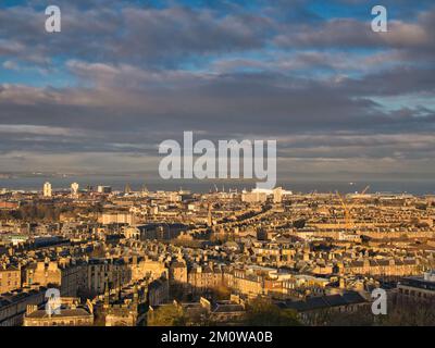 From Calton Hill, a view across the City of Edinburgh to Leith and the Firth of Forth. Taken in winter sunshine. Stock Photo