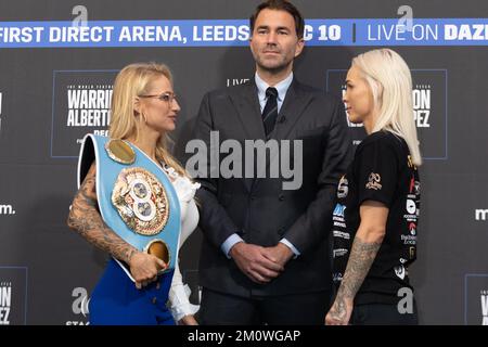 Leeds, UK. 08th Dec, 2022. The Banking Hall, Aspire, Infirmary Street, Leeds, West Yorkshire, 8th December 2022. Boxing promoter Eddie Hearn looks on as Ebanie Bridges (left) and Shannon O'Connell face off during the Josh Warrington vs Luis Alberto Lopez   Undercard Press Conference Credit: Touchlinepics/Alamy Live News Stock Photo
