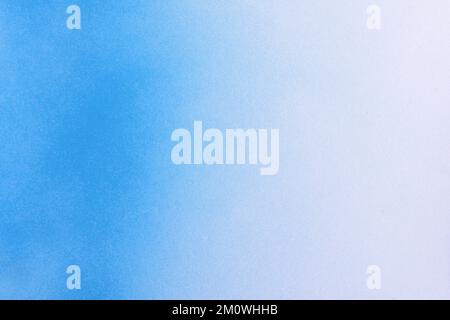 gradient blue spray paint on a white paper background Stock Photo