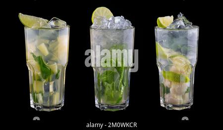 Three alcoholic cocktails with mint and lime. Isolated on black Stock Photo