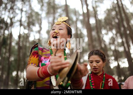 Kathmandu, Nepal. 08th Dec, 2022. Girl from the Kirat community wearing traditional attire seen singing and dancing as she celebrates Sakela festival. Udhauli festival is celebrated by Kirant of eastern Nepal marking the beginning of the winter season and the migration of birds & animals from cold regions to warmer regions. Credit: SOPA Images Limited/Alamy Live News Stock Photo