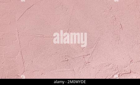 Pink decorative plaster on wall. Texture of rough stucco wall background, soft texture cement wall Stock Photo