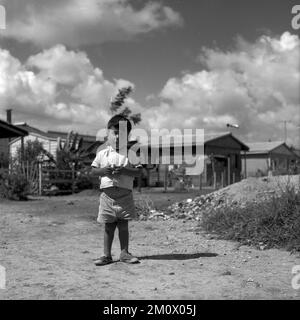 Poor children at Villa Miseria (Misery Village) at Buenos Aires outskirts, circa 1960 Stock Photo