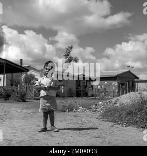 Poor children at Villa Miseria (Misery Village) at Buenos Aires outskirts, circa 1960 Stock Photo