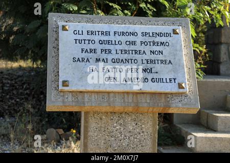 Plaque with a quote by Amedeo Guillet at the Italian Cemetery in Keren Stock Photo