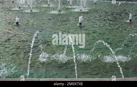 A water fountain sprinkling water in the view Stock Photo