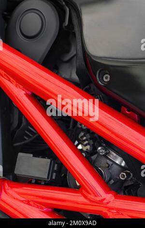 Detail of black motorcycle with red metal protector Stock Photo