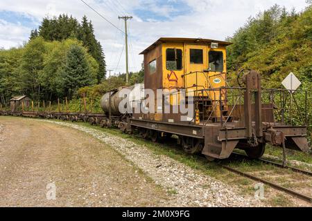 The caboose of an old logging railroad train in the woods Stock Photo