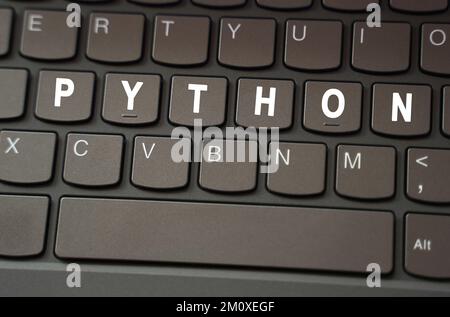 Internet concept. On the black keyboard, the inscription is highlighted in white - Python Stock Photo