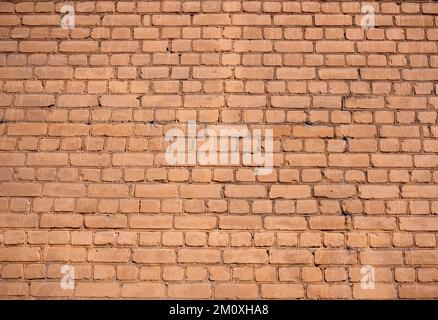 Old red wall from brickwork as background horizontal view closeup Stock Photo