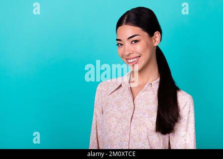 Photo of charming young chinese lady toothy smiling manager recruiter dressed stylish smart casual outfit isolated on cyan color background Stock Photo