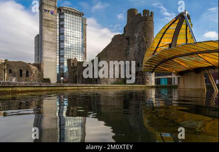 Editorial SWANSEA, UK - DECEMBER 08, 2018: The British Telecom Tower, leaf sculpture and Castle reflected in Castle Square in Swansea City UK Stock Photo