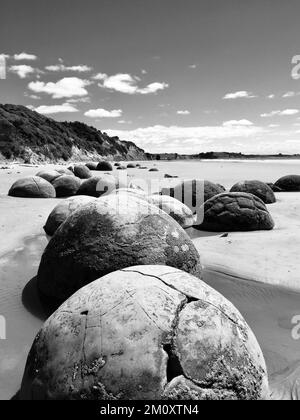 black and white photo of the world famous moeraki boulders. Stock Photo