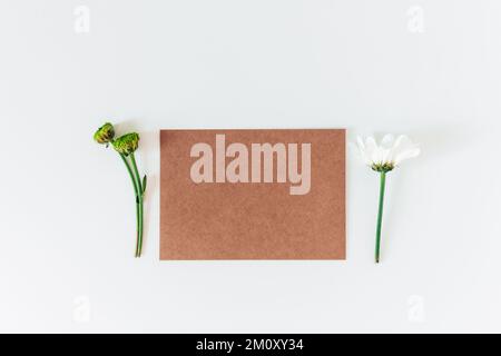Brown recycle cardboard envelope on the white background. Craft paper empty envelope template, mock up. Top view Stock Photo