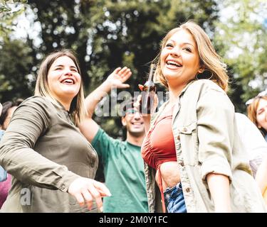 Portrait of two young curvy happy women at a dancing party, message of body positivity Stock Photo