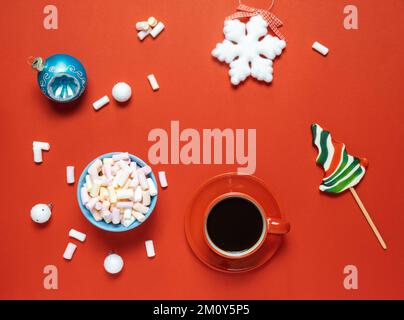 Christmas or winter composition. Cup with coffee, marshmallows and Christmas decor. Flat lay, top view Stock Photo