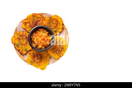 Patacon or toston, fried and flattened pieces of green plantain Stock Photo