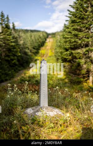 Boundary monument along the USA Canada international border Stock Photo