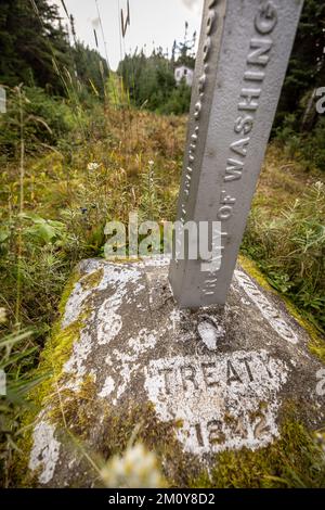 Stone border monument along international Maine and Quebec border Stock Photo