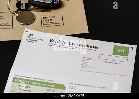 Authentic V11 Vehicle tax reminder letter from DVLA placed on brown envelope. UK road tax for your car. Stafford, United Kingdom, December 8, 2022