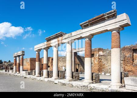 Remains of colonnades in The Forum, Ancient City of Pompeii, Pompei, Metropolitan City of Naples, Campania Region, Italy Stock Photo