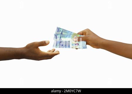 Hand giving 3D rendered Kuwaiti dinar notes to another hand. Hand receiving money Stock Photo