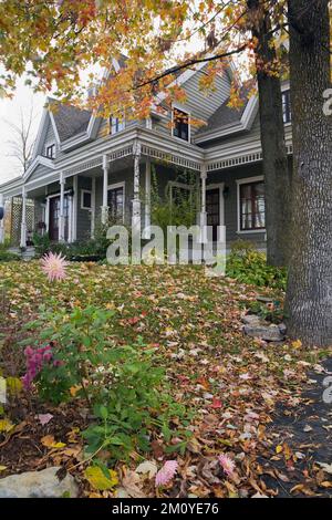 Grey clapboard and white trim two story Victorian country style home ...