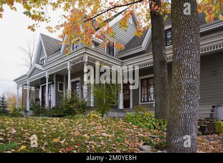 Grey clapboard and white trim two story Victorian country style home ...