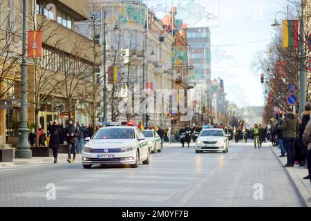 VILNIUS, LITHUANIA - MARCH 11, 2022: Three police cars leading festive parade as Lithuania marked the 32th anniversary of its independence restoration Stock Photo