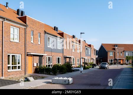 Dutch Suburban area with modern family houses, newly build modern family homes in the Netherlands. Stock Photo