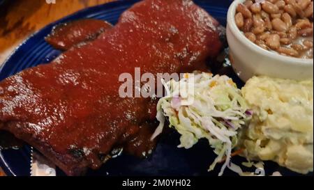 a close up of a plate of BBQ food Stock Photo