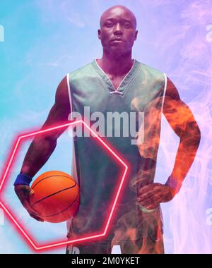Portrait of bald african american basketball player with ball standing by illuminated hexagon. Composite, serious, sport, competition, illustration, g Stock Photo