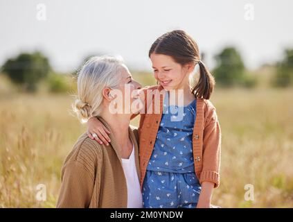 Im looking forward to helping out on the farm, grandma. an adorable little girl on a farm with her grandmother. Stock Photo