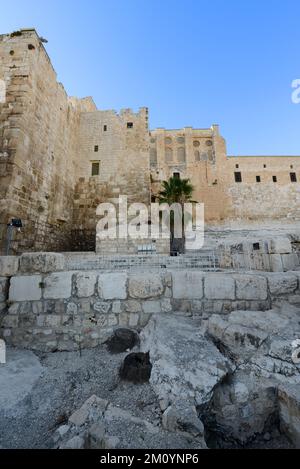 The western (double) Huldah Gate and the monumental staircase at the The southern wall of the Temple Mount in the archeological park in Jerusalem. Stock Photo