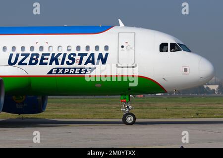 Uzbekistan Airways Express Airbus A320 aircraft taxiing at Tashkent Airport in Uzbekistan. Airplane of Uzbekistan Express. Plane registered as UK32012 Stock Photo