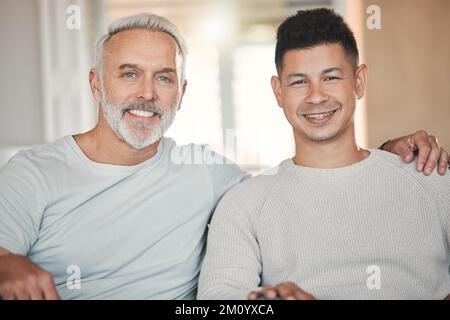 Quality time with your family. a father and son sitting on the sofa at home. Stock Photo