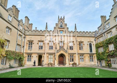 Student on the path in Chapel Court, Sidney Sussex college, University of Cambridge, England. Stock Photo