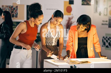 Precision meets pretty. a group of designers collaborating at a workshop together. Stock Photo