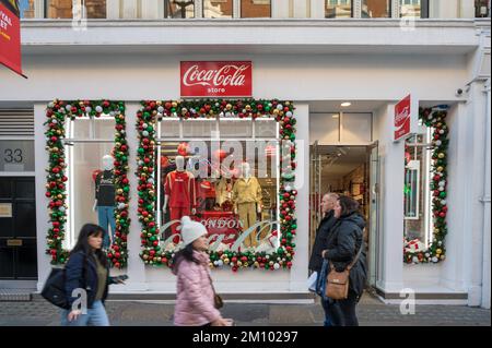 Shopfront of the Coca Cola store with Christmas decorations. Covent