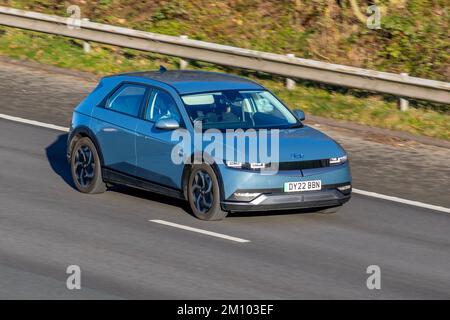 2022 Blue HYUNDAI IONIQ 5 SE CONNECT EV Electricity; travelling on the M61 motorway, UK Stock Photo