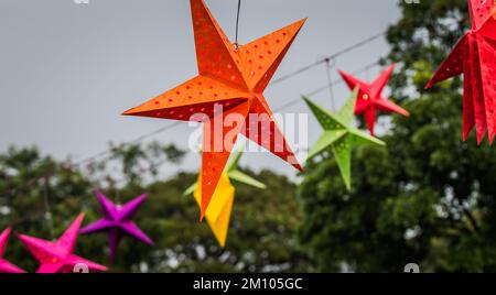 red star with other stars soft focus on naturally blurred background Stock Photo