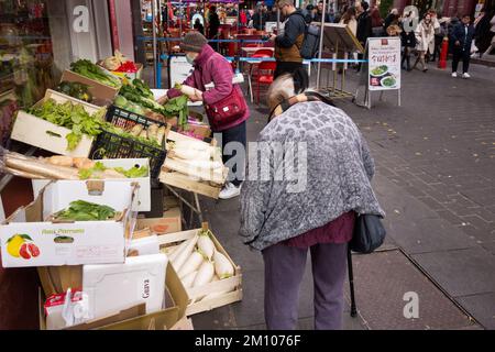 An elegant and dignified Chinese old woman on Gerrard Street in China Town, Soho, London, England, UK Stock Photo