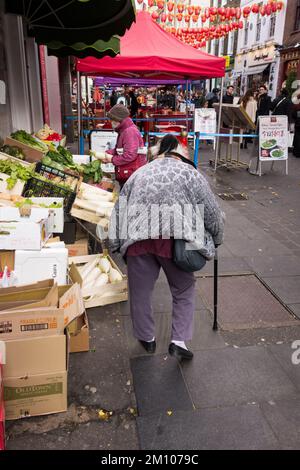 An elegant and dignified Chinese old woman on Gerrard Street in China Town, Soho, London, England, UK Stock Photo