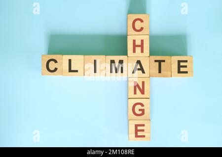 Climate change solution concept. Wooden blocks crossword puzzle flat lay. Stock Photo